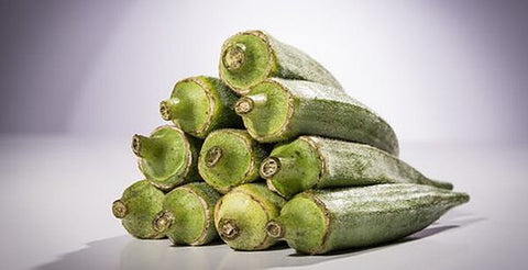 Smooth Green okra pods stacked after harvest, open-pollinated variety