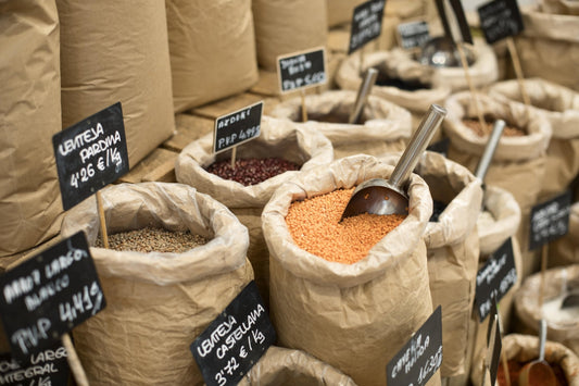 Sacks of cover crop seed prepared for a custom plantation seed mix